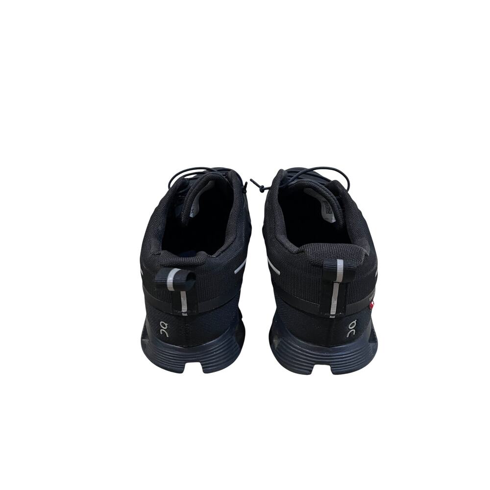 On Cloud waterproof running shoes for women in solid black. - Picture 4 of 9
